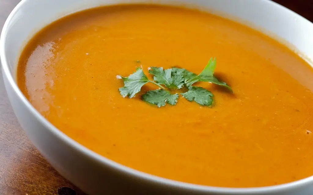 A bowl of curried butternut squash and apple soup