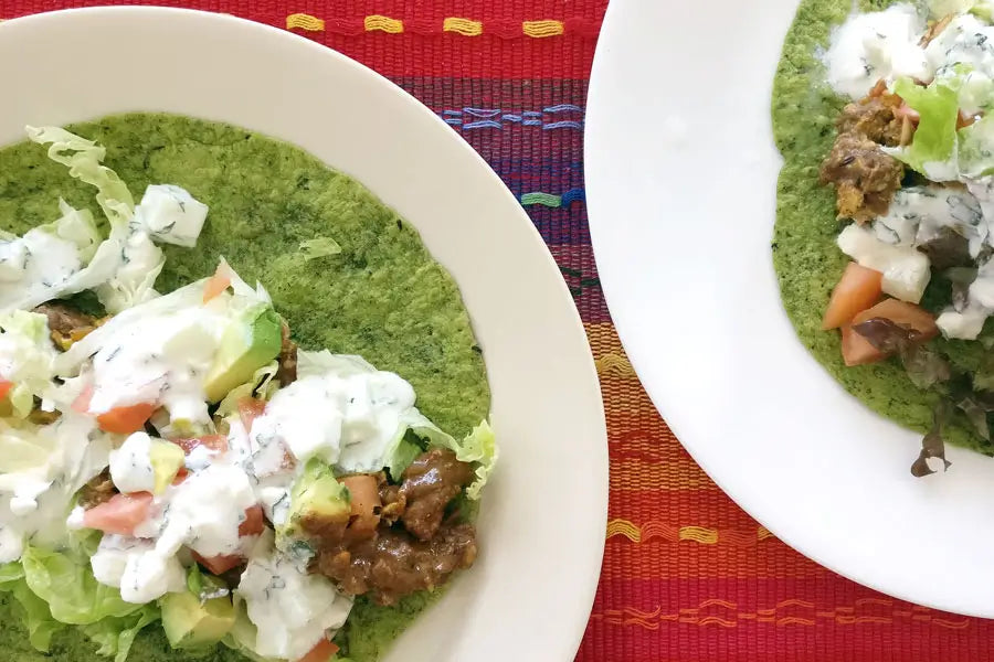 2 plates of Indian style fusion tacos