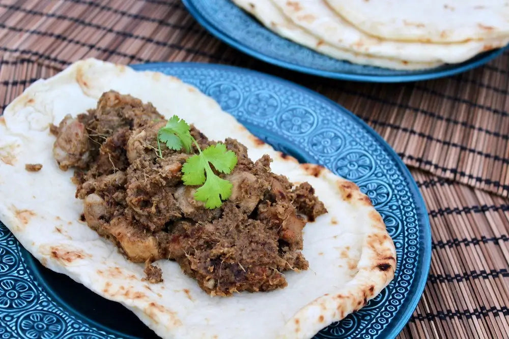 Pork tikka on a piece of naan