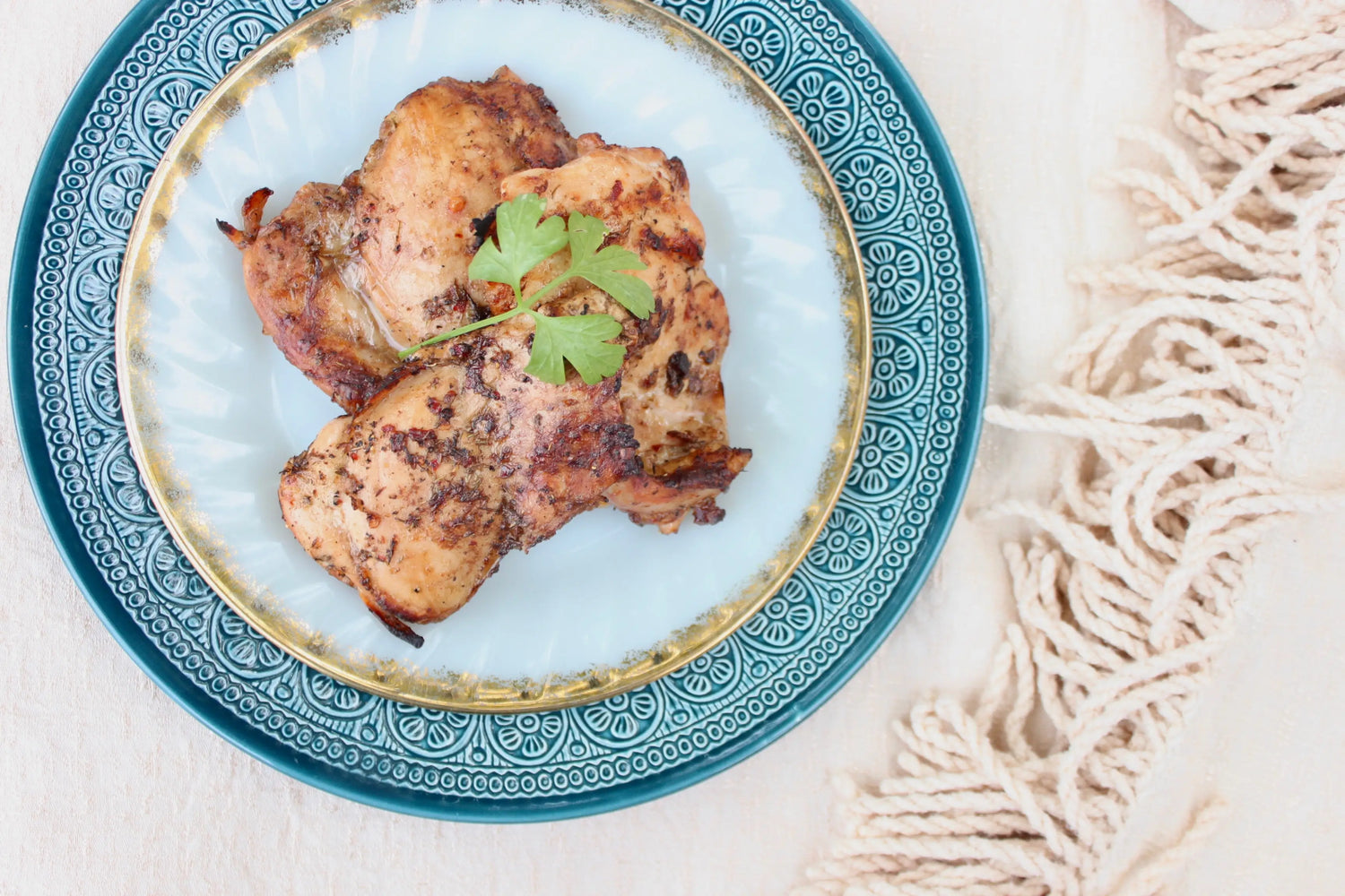 A plate of roasted chicken thighs.