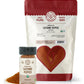 One 8 oz bag and one 2.1 oz jar of organic cayenne pepper from Pure Indian Foods sit side by side on a white surface