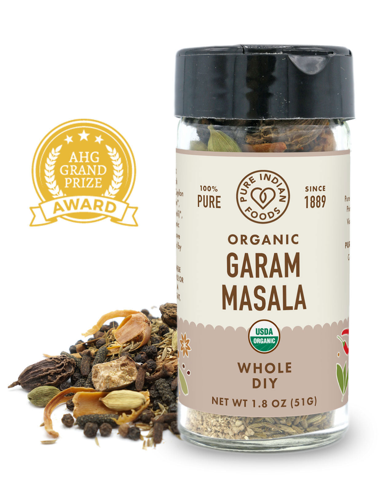 A jar of organic whole garam masala from Pure Indian Foods, in front of a pile of the whole spices, on a white surface. An AHG Grand Prize Award badge is displayed near them.