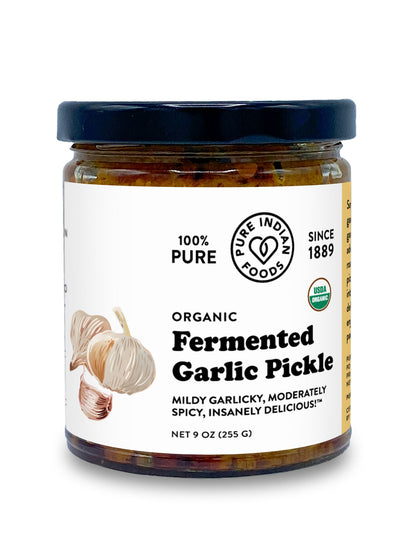 Jar of Organic Fermented Indian Garlic Pickle from Pure Indian Foods. The label claims it's a mildly garlicky, moderately spicy, insanely delicious pickled garlic achaar.