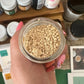 An open jar of white Sandalwood powder